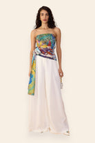 Saaksha & Kinni abstract print strapless blouse and white wide-leg palazzo set, front view