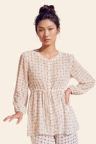 Nautanky ivory printed blouse with softly gathered bodice, styling detail